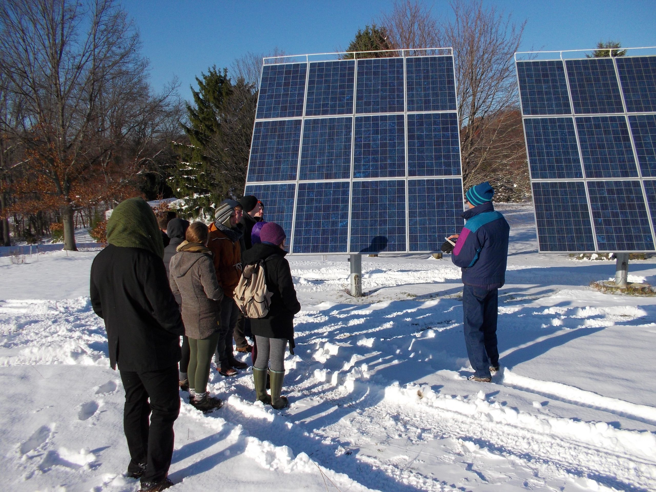 Dr. Askew shows students a photovoltaic (PV) power system